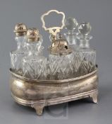 A George III silver shaped oval boat shaped cruet stand, with wooden base and reeded borders,