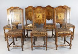 A set of seven early 18th century Italian walnut dining chairs, the backs with inlaid marquetry