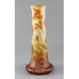 A tall Galle cameo glass vase, c.1900, decorated with lilies in amber over frosted clear glass,