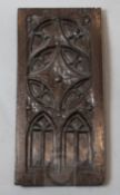 An early 16th century oak panel, carved with gothic tracery, 17.5 x 8.5in.