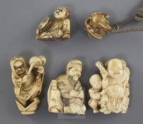 Four Japanese ivory netsuke and a similar ojime, Meiji period, two of the netsuke carved as