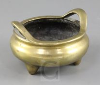 A Chinese bronze censer, 19th century, the base cast in relief with a Xuande mark surrounded by a