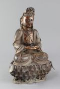 A large Chinese lacquered bronze seated figure of Guanyin, on a separate lotus stand, her robes