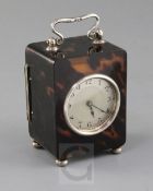 An Edwardian silver mounted tortoiseshell rectangular carriage timepiece, with silvered Arabic dial,