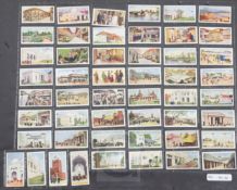 Four folio albums of cigarette cards on the themes of Treasures, Arms, Royalty, Pageantry, etc.,