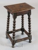An unusually small late 17th century oak joint stool, on bobbin turned legs