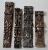 Four 16th / 17th century carved oak corbels, one carved with five figures, largest 21in.