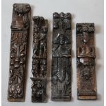 Four 16th / 17th century carved oak corbels, one carved with five figures, largest 21in.