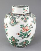 A Chinese famille verte jar and cover, late 19th century, painted with flower sprays and lappeted