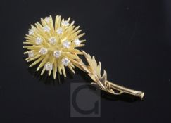 A French 18ct gold and diamond set brooch, modelled as a thistle, gross 13.3 grams, 51mm.