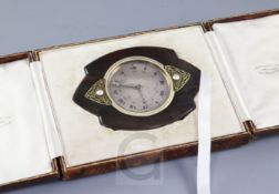 An early 20th century Art Nouveau white enamel inlaid tortoiseshell strutt clock, of shaped