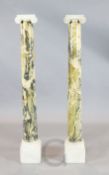 A pair of Giallo Antico marble Ionic columns, H.4ft 2in.