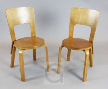 A pair of Finmar Ltd bentwood dining chairs, model 66, designed by Alvar Aalto, one with Finmar
