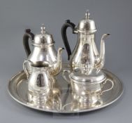 A 20th century matched Tiffany & Co sterling silver four piece tea set and circular tray, of early