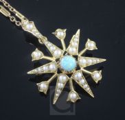 An Edwardian 15ct gold, white opal and split pearl starburst pendant on a later 9ct gold chain,