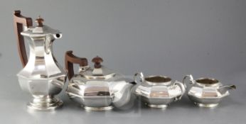 A George V silver three piece octagonal tea set and similar hot water jug, tea set, G. Unite &