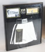 Muhammed Ali. A pair of signed boxing trunks from the 1960 USA Olympics, in display case,