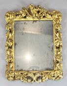 A late 17th century Italian carved giltwood frame wall mirror, W.1ft 10in. H.2ft 4in.