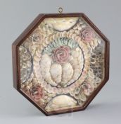 A 19th century sailor's shell-work Valentine, with a central heart and flower motifs, in octagonal
