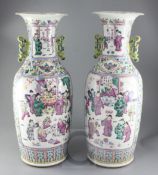 A pair of large Chinese Canton-decorated famille rose two handled baluster vases, late 19th century,