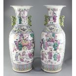 A pair of large Chinese Canton-decorated famille rose two handled baluster vases, late 19th century,