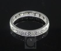 A platinum? and diamond full eternity ring, set with twenty round cut diamonds, size M.