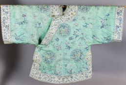 A Chinese embroidered silk mint green brocade robe, early 20th century, finely woven with roundels
