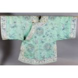 A Chinese embroidered silk mint green brocade robe, early 20th century, finely woven with roundels