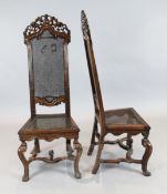 A pair of 17th century Flemish walnut hall chairs, with caned backs and seats W.1ft 8in. H.4ft 3in.