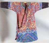 A Chinese claret satin embroidered silk and metal thread 'dragon' robe, late Qing dynasty, nine
