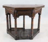 A 17th century oak credence table, with later folding top and central drawer, canon barrel legs