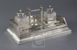 An Edwardian silver rectangular inkstand by Martin, Hall & Co, with pierced three quarter raised