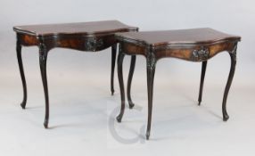 A fine pair of George III French Hepplewhite mahogany card tables, with serpentine folding tops, urn