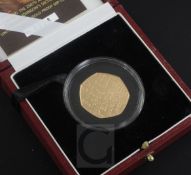 A cased Royal Mint 2005 gold proof 50p coin, commemorating Samuel Johnson's Dictionary, no. 0228/