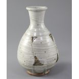 Bernard Leach (1887-1979). A bottle shaped vase, the celadon-grey vase with white slip trailing rust