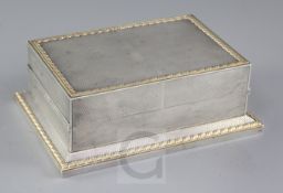 A good George V engine turned parcel gilt silver double lidded rectangular playing card box by