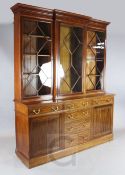 An Edwardian crossbanded mahogany library bookcase, the upper breakfront section with three astragal