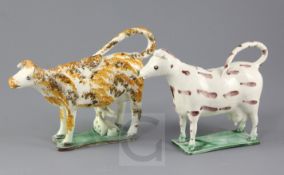 Two Yorkshire pearlware cow creamers, early 19th century, one example modelled with a milk maid with