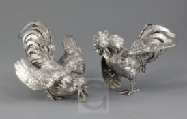 A pair of German naturalistically cast 800 standard silver models of fighting cocks, Ludwig
