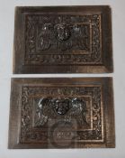 A pair of 18th century oak panels, carved with a winged armorini, 11 x 16in.