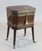 A George III brass bound mahogany octagonal cellaret, with lion's mask ring handles, W.1ft 8in. D.