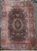 A Persian cream ground carpet, with central medallion in a foliate field, with multi row border,