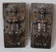 A pair of 17th century oak panels, carved with female Aztec Indian figures, 8 x 3.5in.
