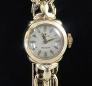 A lady's 1950's 9ct gold Rolex manual wind wrist watch, with baton numerals, on a 9ct gold Rolex