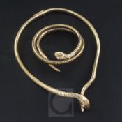 A 1980's 9ct gold and gem set coiled snake bracelet and similar necklace, gross 60 grams.