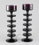 Ronald Stennett-Willson for Wedgwood. Two Sheringham five disc amethyst glass candlesticks, 22.5cm