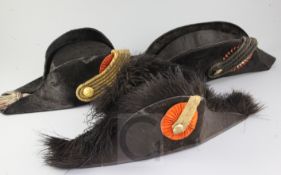 Three 19th century officer's bicorn hats, one by J.P. Hol of Braeda,