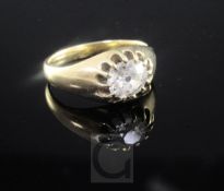 A late 19th/early 20th century gold and claw set solitaire diamond ring, the old oval cushion cut