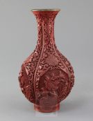 A Chinese cinnabar lacquer bottle vase, first half 20th century, carved in high relief with