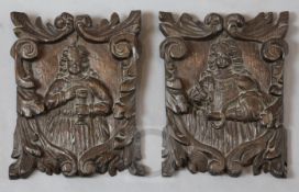 A pair of 17th century oak panels, carved with the figures of a King and Queen, within acanthus